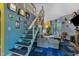 Cozy living room with staircase, comfortable seating, and access to the outdoor at 3312 Hawk Ridge Rd, Chapel Hill, NC 27516