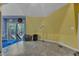 Bright living area with yellow accent wall and door leading to a wooden deck at 3312 Hawk Ridge Rd, Chapel Hill, NC 27516