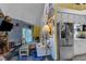 Open living room showcases a stone fireplace, sliding glass doors, and bright kitchen space at 3312 Hawk Ridge Rd, Chapel Hill, NC 27516