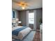 Bedroom with a ceiling fan, window, light walls, and a comfortable bed at 3609 Cold Harbour Dr, Raleigh, NC 27610