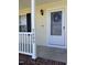 The front door with a decorative wreath and the house number on the side of the porch at 3609 Cold Harbour Dr, Raleigh, NC 27610