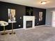 Living room boasts dark walls, a white fireplace, and modern décor, perfect for entertaining at 3609 Cold Harbour Dr, Raleigh, NC 27610