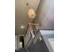 Staircase with gray walls, white trim, wood banister, and contemporary light fixture at 3609 Cold Harbour Dr, Raleigh, NC 27610