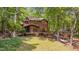 Charming backyard featuring a spacious deck, hot tub, and cozy hammock area at 3622 Moonlight Dr, Chapel Hill, NC 27516