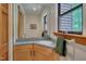 Small half-bath with a corner sink and window views at 3622 Moonlight Dr, Chapel Hill, NC 27516