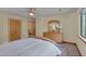 Relaxing bedroom with a plush bed, wood furnishings, and a window overlooking lush greenery at 3622 Moonlight Dr, Chapel Hill, NC 27516