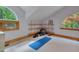 Bright bonus room featuring soft carpet, arched windows, and shelving at 3622 Moonlight Dr, Chapel Hill, NC 27516