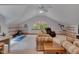 Bonus room featuring plush sofas, soft carpet, and natural light from an arched window at 3622 Moonlight Dr, Chapel Hill, NC 27516