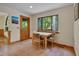 Cozy dining area with wood table set near window and adjacent to a wooden entry door at 3622 Moonlight Dr, Chapel Hill, NC 27516
