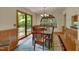 Elegant dining room with wood table, chairs, and access to the outdoor deck at 3622 Moonlight Dr, Chapel Hill, NC 27516