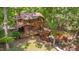 Wood home with spacious deck, hot tub, lush trees and green lawn at 3622 Moonlight Dr, Chapel Hill, NC 27516