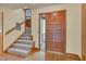 Bright foyer with hardwood floors, staircase, and a wood front door at 3622 Moonlight Dr, Chapel Hill, NC 27516