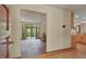 Open living room layout with brick flooring and a large glass door leading to the outdoor deck at 3622 Moonlight Dr, Chapel Hill, NC 27516