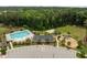 An aerial shot of a community center, pool, playground, and parking, showcasing community amenities at 3700 Horton Hill Dr, New Hill, NC 27562