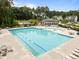 Community pool area with lounge chairs, tables, and a wading area for Gathering fun at 3700 Horton Hill Dr, New Hill, NC 27562