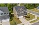 An aerial view of a home with an attached two-car garage and landscaped front yard at 3700 Horton Hill Dr, New Hill, NC 27562
