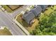 Aerial view showcases a well-maintained home with a spacious backyard on a corner lot at 3700 Horton Hill Dr, New Hill, NC 27562