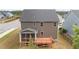 View of home's rear exterior featuring a deck and a screened porch at 3700 Horton Hill Dr, New Hill, NC 27562