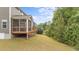 This backyard features a screened porch, spacious deck, and a well-maintained lawn area at 3700 Horton Hill Dr, New Hill, NC 27562