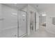 Tiled shower with glass doors, built-in seat, and modern fixtures at 3700 Horton Hill Dr, New Hill, NC 27562