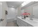 A bathroom featuring double sinks, a large mirror, and a shower-tub combo at 3700 Horton Hill Dr, New Hill, NC 27562