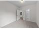 A bedroom with carpet and view into the kitchen and bathroom at 3700 Horton Hill Dr, New Hill, NC 27562