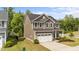 Charming two-story home with a well-manicured lawn and a two-car garage at 3700 Horton Hill Dr, New Hill, NC 27562