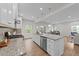Spacious kitchen with a granite counter top island, stainless steel appliances, and tile backsplash at 3700 Horton Hill Dr, New Hill, NC 27562