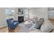 Cozy living room with a fireplace, comfortable seating, and modern decor at 3700 Horton Hill Dr, New Hill, NC 27562