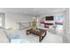 Living room on the second floor with hardwood floors and a dark wood railing at 3700 Horton Hill Dr, New Hill, NC 27562