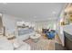 Open-concept living room with fireplace flowing into kitchen and dining area at 3700 Horton Hill Dr, New Hill, NC 27562