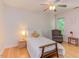 Comfortable bedroom with hardwood flooring, neutral tones, and a cozy chair for a relaxing space at 401 Robert Hunt Dr, Carrboro, NC 27510