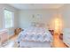 Cozy bedroom featuring hardwood floors, a window, and playful decor, perfect for a space at 401 Robert Hunt Dr, Carrboro, NC 27510