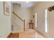 Bright foyer with hardwood floors, staircase, and natural light creating a welcoming entrance at 401 Robert Hunt Dr, Carrboro, NC 27510