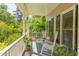 Charming front porch featuring rocking chairs, plants, and serene views of the surrounding greenery at 401 Robert Hunt Dr, Carrboro, NC 27510