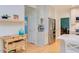 Bright kitchen features light wood floors, white cabinets, stainless appliances and opens to other rooms at 401 Robert Hunt Dr, Carrboro, NC 27510