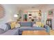Open-concept living room flows to kitchen, complete with comfortable sectional sofa, wood floors and natural light at 401 Robert Hunt Dr, Carrboro, NC 27510