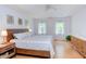 Spacious main bedroom boasting hardwood floors, natural light, and a large bed at 401 Robert Hunt Dr, Carrboro, NC 27510