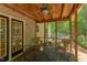 Inviting screened-in porch with a ceiling fan, perfect for relaxing and enjoying outdoor views at 401 Robert Hunt Dr, Carrboro, NC 27510