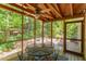 Enjoy the nature views in this screened in porch with a ceiling fan and wooden deck at 401 Robert Hunt Dr, Carrboro, NC 27510