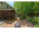 Relaxing screened porch with outdoor seating and a view of the wooded yard at 401 Robert Hunt Dr, Carrboro, NC 27510