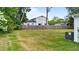 A large backyard with a privacy fence and an air conditioning unit visible at 412 W Stallings St, Clayton, NC 27520