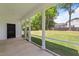 Relaxing screened-in porch overlooking green lawn and private backyard at 412 W Stalllings St, Clayton, NC 27520