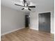 Cozy bedroom with hardwood floors, a ceiling fan, closet, and a neutral color palette at 412 W Stalllings St, Clayton, NC 27520