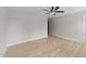 Bedroom featuring hardwood floors, neutral walls, and bright light from the window at 412 W Stalllings St, Clayton, NC 27520