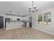 Eat-in kitchen featuring granite countertops, stainless steel appliances, and gray cabinets at 412 W Stalllings St, Clayton, NC 27520