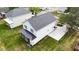 Aerial shot of the home's rear featuring a screened in porch and a spacious lawn at 412 W Stalllings St, Clayton, NC 27520
