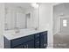 Bathroom featuring double vanity, framed mirror, and tiled shower/tub at 416 Longleaf Glen Ln, Zebulon, NC 27597