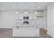 Beautiful kitchen featuring a large island with marble countertop, stainless steel appliances, and pendant lighting at 416 Longleaf Glen Ln, Zebulon, NC 27597