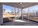 Spacious screened porch with views of the backyard and wooded area at 416 Longleaf Glen Ln, Zebulon, NC 27597